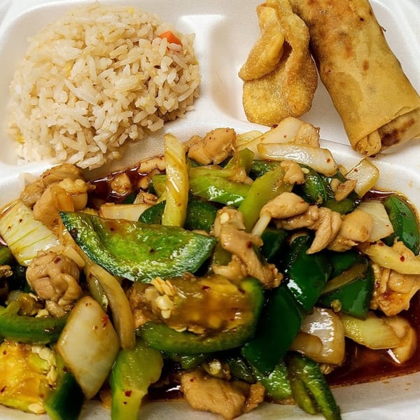 Tsing Tsao Chinese Fast Food's pepper chicken with fried rice, an egg roll, and crab rangoon.